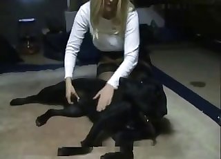 Blond-haired MILF jerks a dog