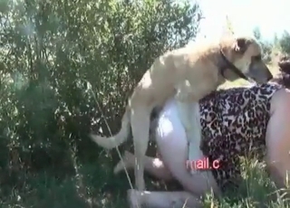 Naked female zoophile frolicking with her doggy