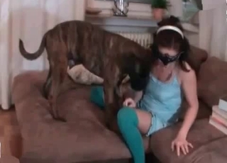 Masked chick is enjoying her lovely dog