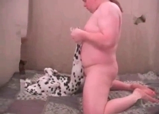 Insatiable man is having sex with a cute doberman