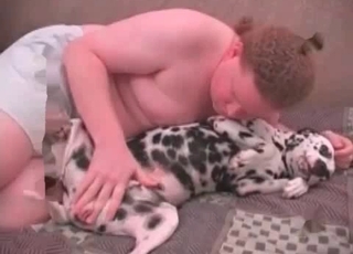 Insatiable man is having sex with a cute doberman