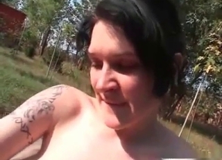 Tatted-up junkie-looking whore and a dog