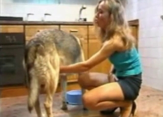 Doggy is getting a very nice hand job